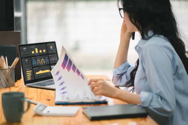 unincorporated business owned Businesswoman accountant using a calculator, graphs, and charts to analyze market data, balance sheets,accounts,and net profits in order to plan new sales strategies. Businesswoman accountant using a calculator, graphs, and charts to analyze market data, balance sheets,accounts,and net profits in order to plan new sales strategies Business Operations  stock pictures, royalty-free photos & images